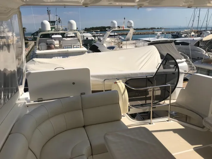 Saturnia Yacht Photos Pics Luxurious 2009 Grand Banks 59 Aleutian RP yacht docked at a marina.