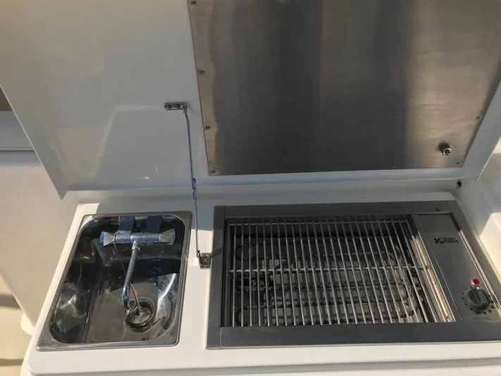 Saturnia Yacht Photos Pics Outdoor sink and grill on 2009 Grand Banks 59 Aleutian RP yacht.