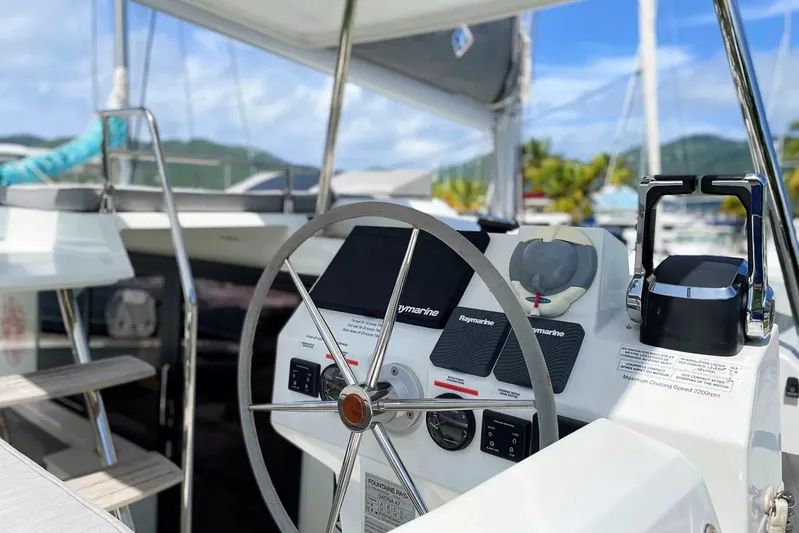 Idalia Yacht Photos Pics 2020 Fountaine Pajot Saona 47 Maestro yacht helm with modern navigation equipment.