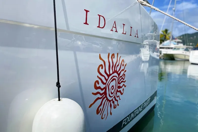 Idalia Yacht Photos Pics 2020 Fountaine Pajot Saona 47 Maestro catamaran with sun design, docked in marina.