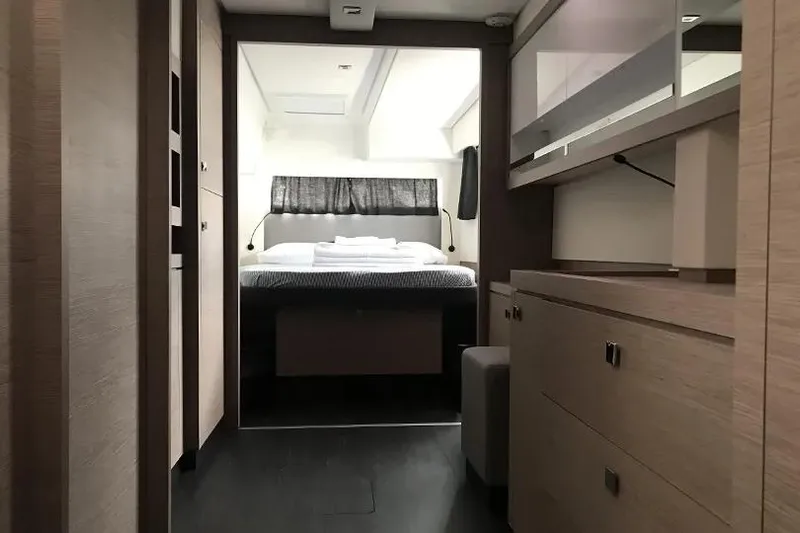 Idalia Yacht Photos Pics Interior of 2020 Fountaine Pajot Saona 47 Maestro, featuring a cozy bedroom and modern furnishings.