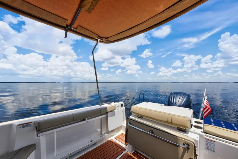  Yacht Photos Pics 2024 Ranger Tugs R-27 boat interior with ocean view and American flag.