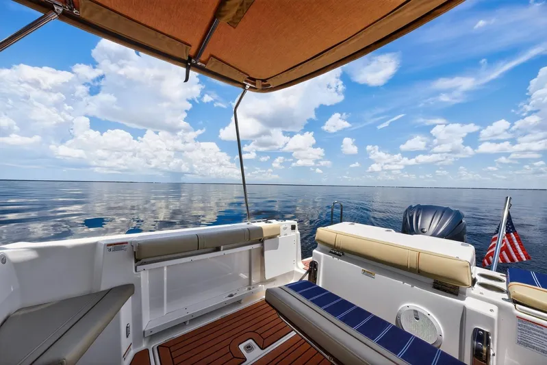  Yacht Photos Pics 2024 Ranger Tugs R-27 boat interior with ocean view and American flag.