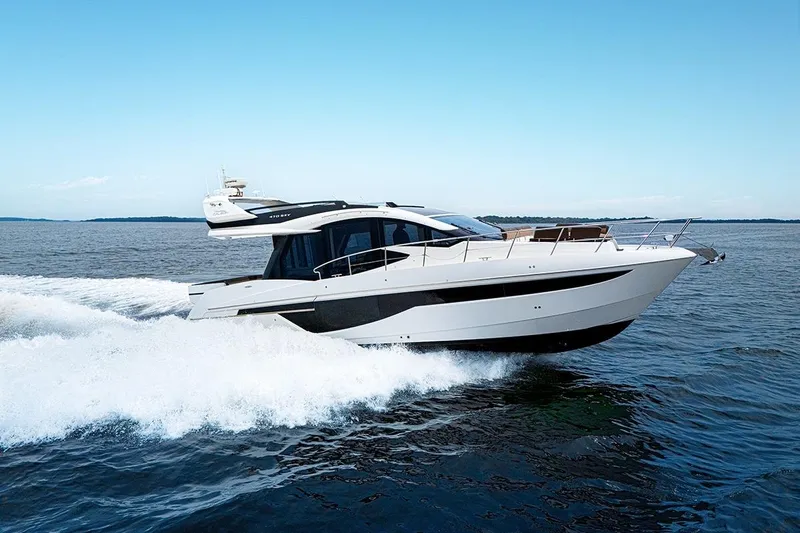 American Pride Yacht Photos Pics 2023 Galeon 470 Sky yacht cruising on open water under clear blue skies.