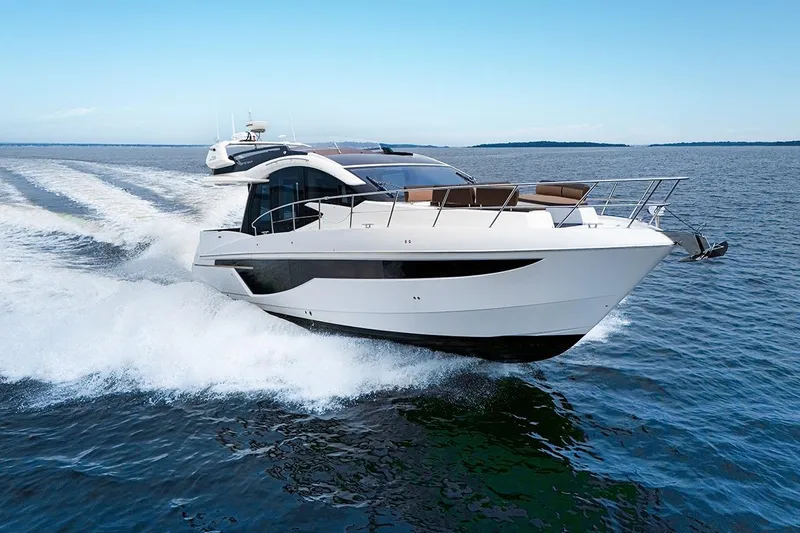 American Pride Yacht Photos Pics 2023 Galeon 470 Sky yacht cruising on open water, showcasing sleek design and luxury features.