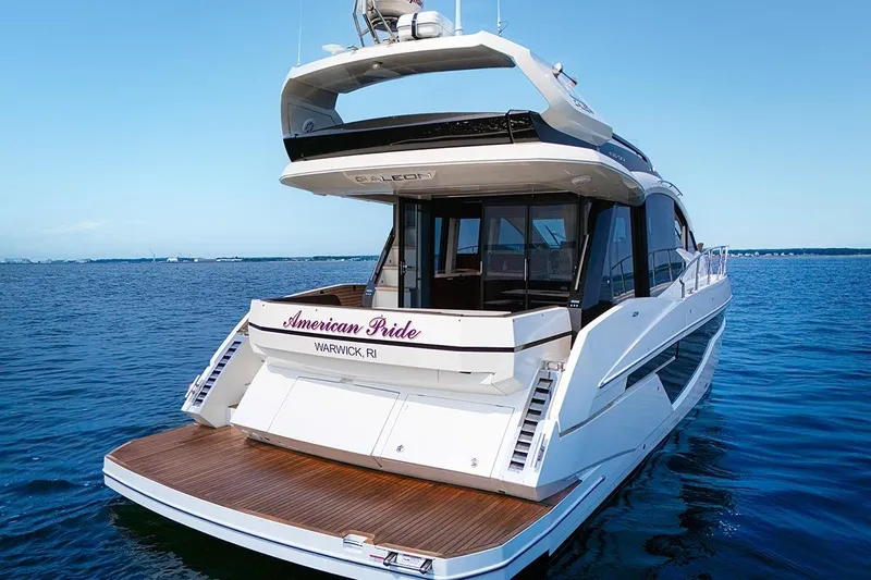 American Pride Yacht Photos Pics 2023 Galeon 470 Sky yacht on water, rear view, named "American Pride," Warwick, RI.