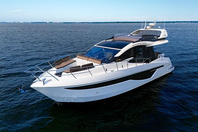 American Pride Yacht Photos Pics 2023 Galeon 470 Sky yacht cruising on open water under clear skies.