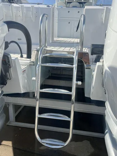 Under Dealer Cost Yacht Photos Pics 2024 Twin Vee 400 Center Console GFX with stainless steel swim ladder.