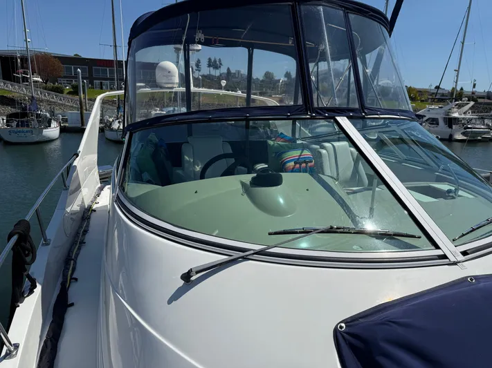  Yacht Photos Pics 2006 Carver 36 Mariner yacht docked at marina, featuring sleek design and spacious cockpit.