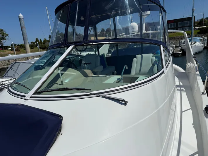  Yacht Photos Pics 2006 Carver 36 Mariner yacht with sleek design, docked at marina.