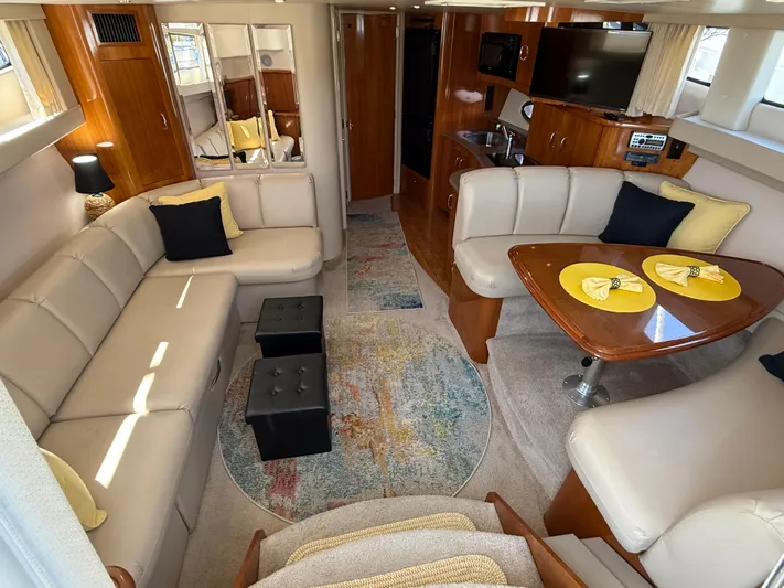  Yacht Photos Pics Luxurious interior of a 2006 Carver 36 Mariner yacht with elegant seating and dining area.