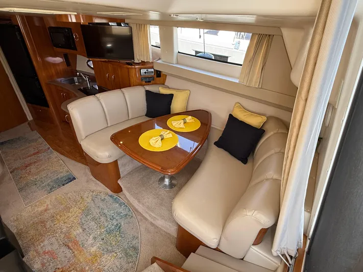  Yacht Photos Pics Interior of 2006 Carver 36 Mariner yacht with cozy dining area and modern amenities.