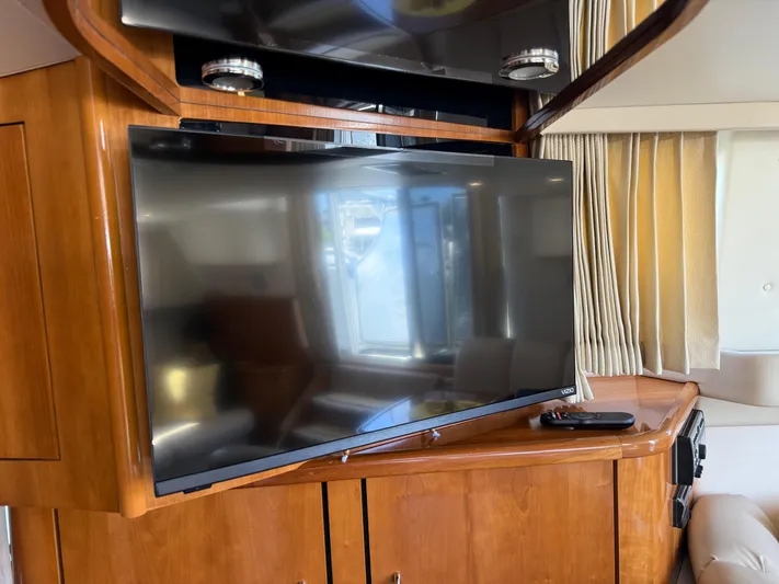  Yacht Photos Pics Flat-screen TV in 2006 Carver 36 Mariner yacht interior with wooden cabinetry.