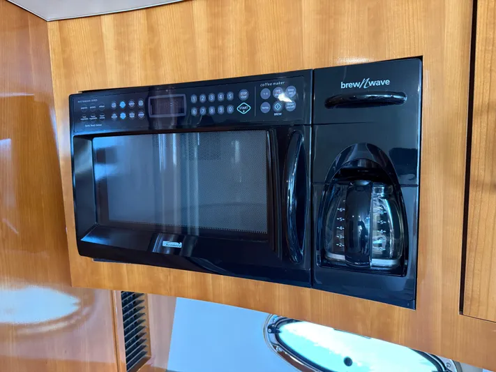  Yacht Photos Pics Built-in microwave and coffee maker in 2006 Carver 36 Mariner yacht kitchen.
