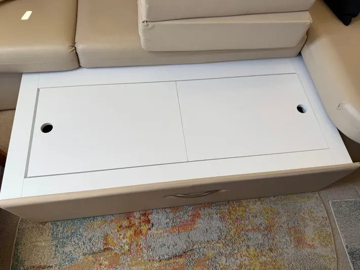  Yacht Photos Pics Interior of 2006 Carver 36 Mariner with beige seating and white storage compartment.