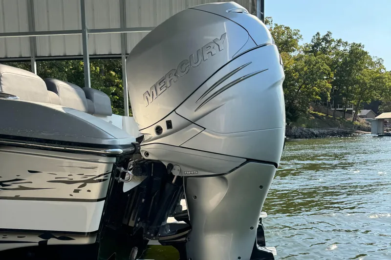  Yacht Photos Pics 2022 Fountain 38 SC boat with Mercury outboard motor on a lake.
