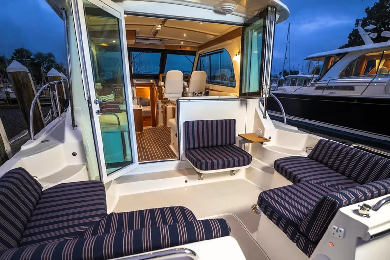  Yacht Photos Pics 2026 Back Cove 372 yacht interior with striped seating and elegant design.