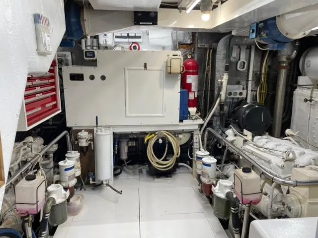 Dame De Coeur Yacht Photos Pics Engine room of 1982 Cheoy Lee 66 LRC yacht, featuring machinery and equipment.