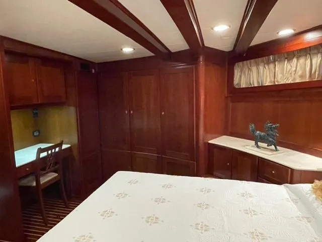 Dame De Coeur Yacht Photos Pics Luxurious 1982 Cheoy Lee 66 LRC yacht cabin with elegant wood interior and cozy furnishings.