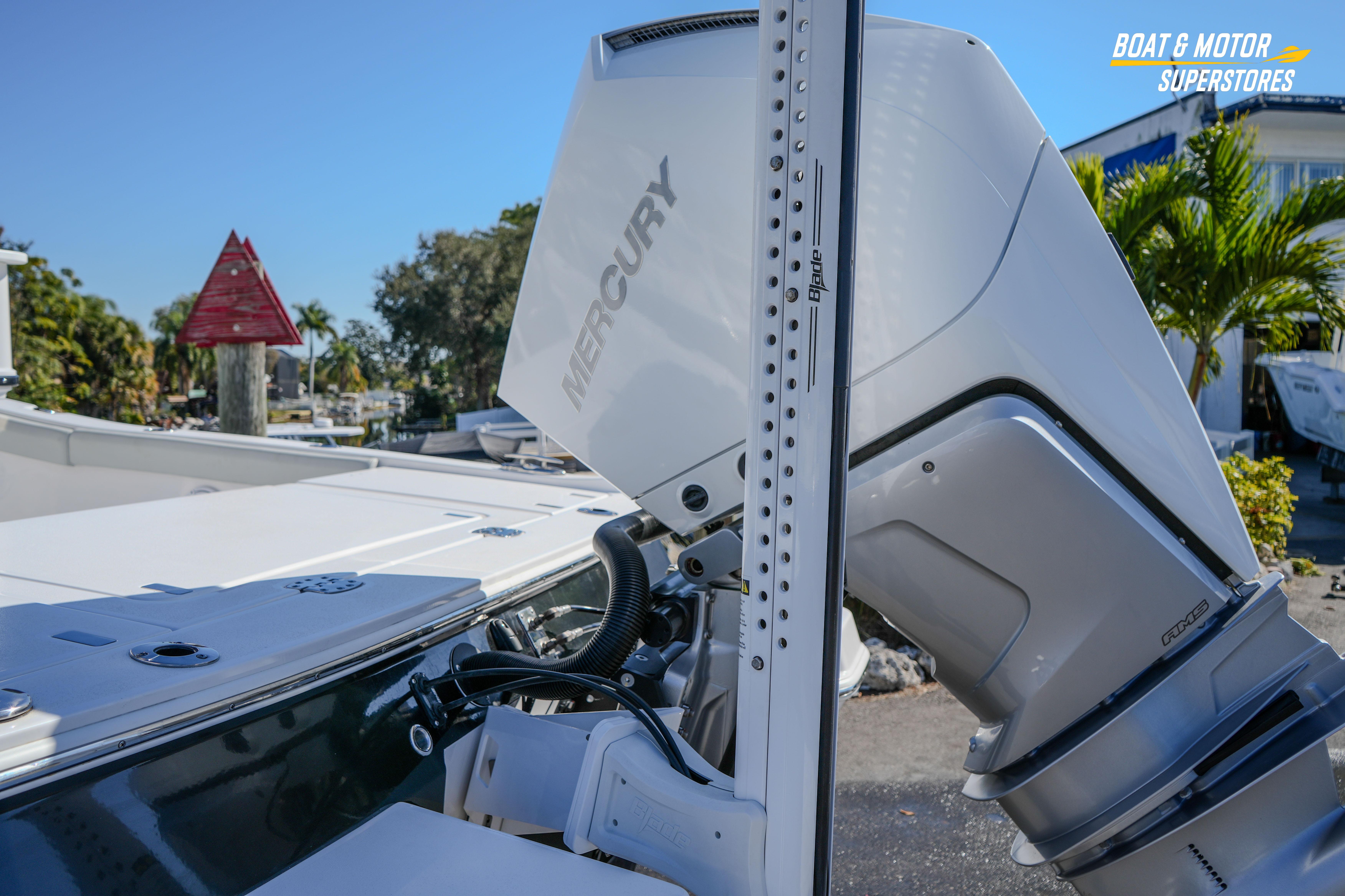 2025 Blackfin 262 HB boat with Mercury engine, docked outdoors.