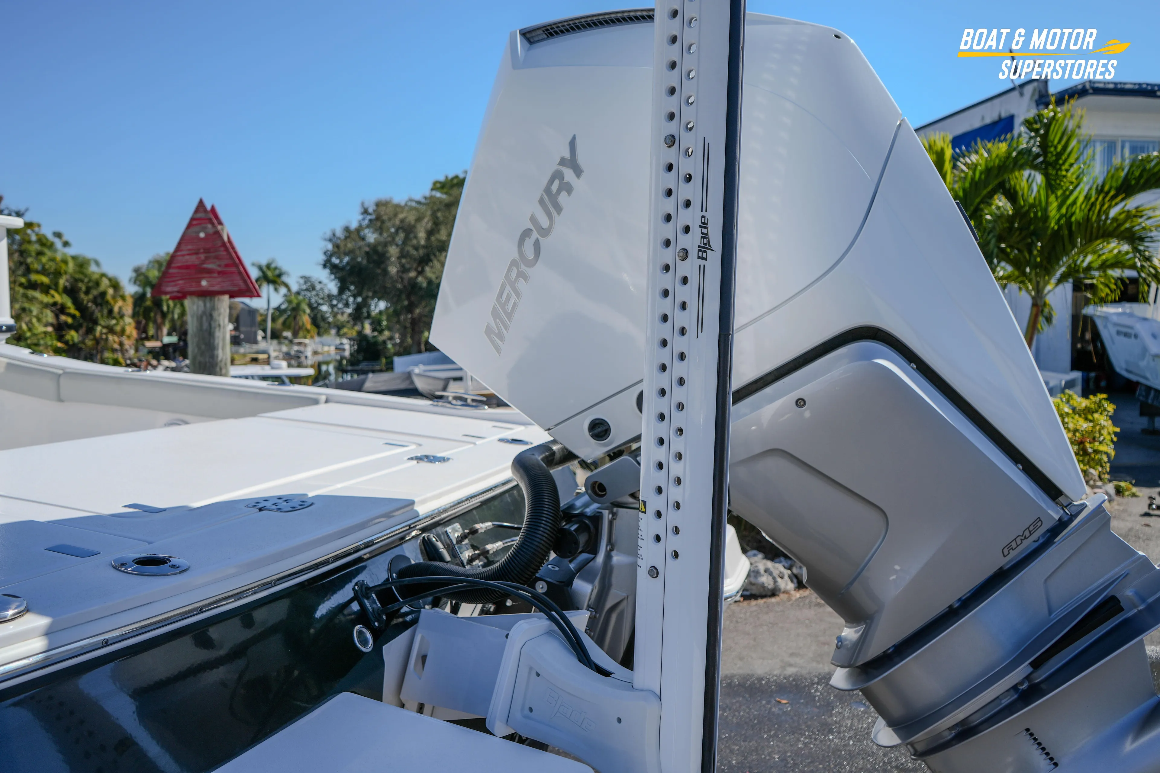 2025 Blackfin 262 HB boat with Mercury engine, docked outdoors.