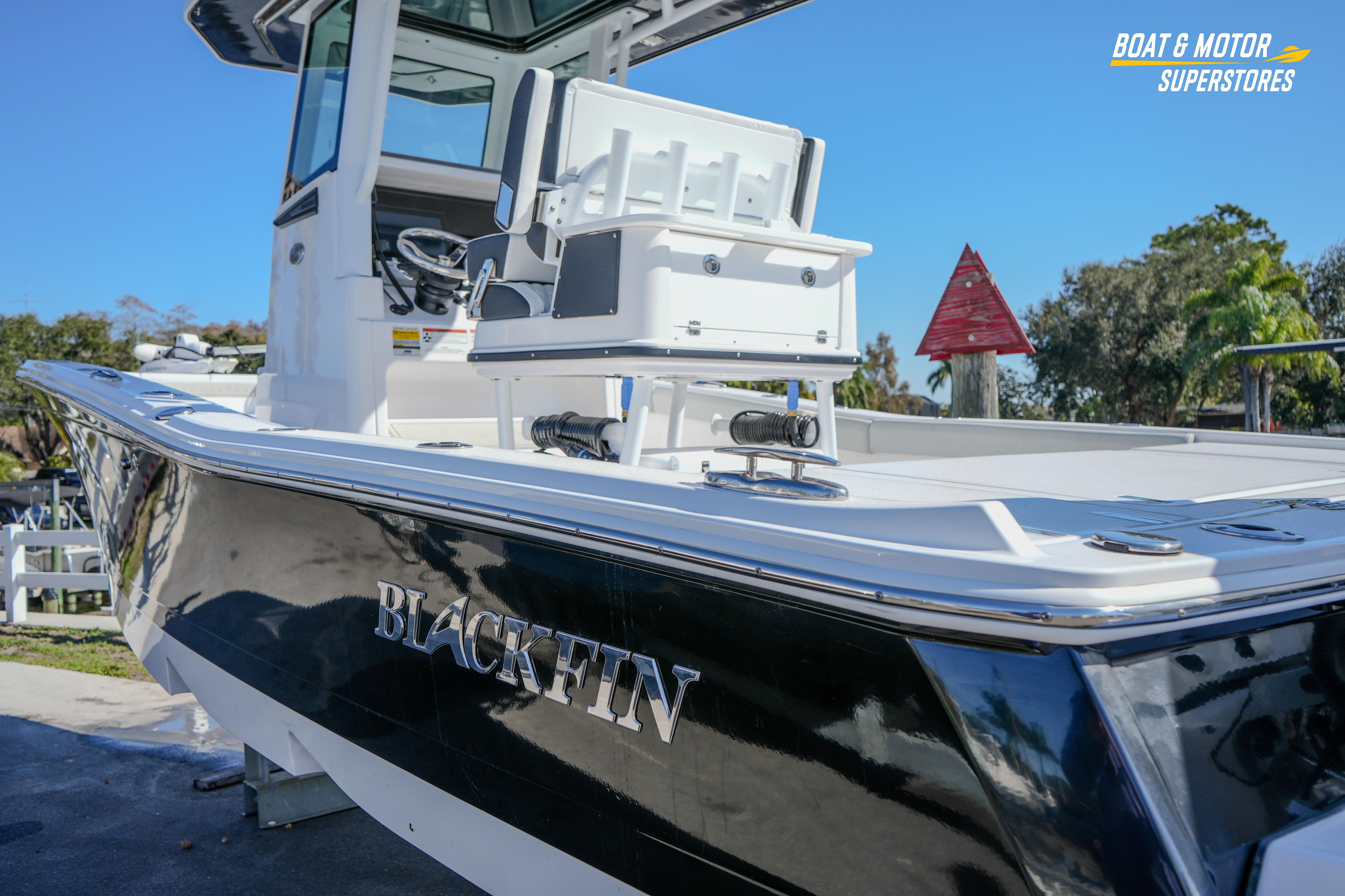 2025 Blackfin 262 HB boat with sleek black hull, showcased outdoors.