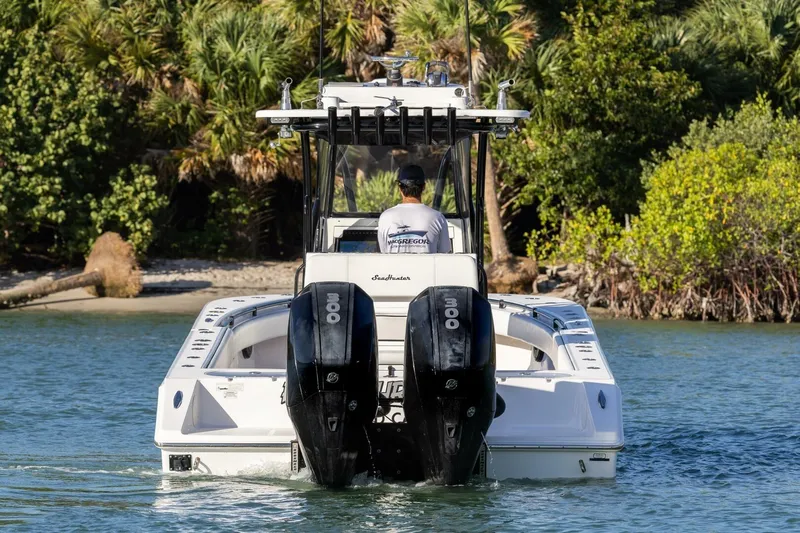  Yacht Photos Pics 2019 SeaHunter 28 Floridian boat with dual engines navigating through water.