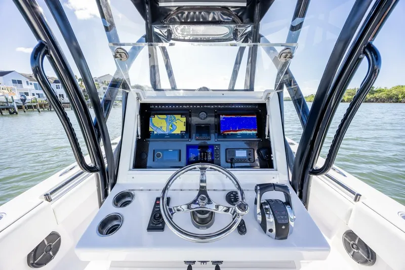  Yacht Photos Pics Cockpit view of 2019 SeaHunter 28 Floridian boat with navigation screens and controls.