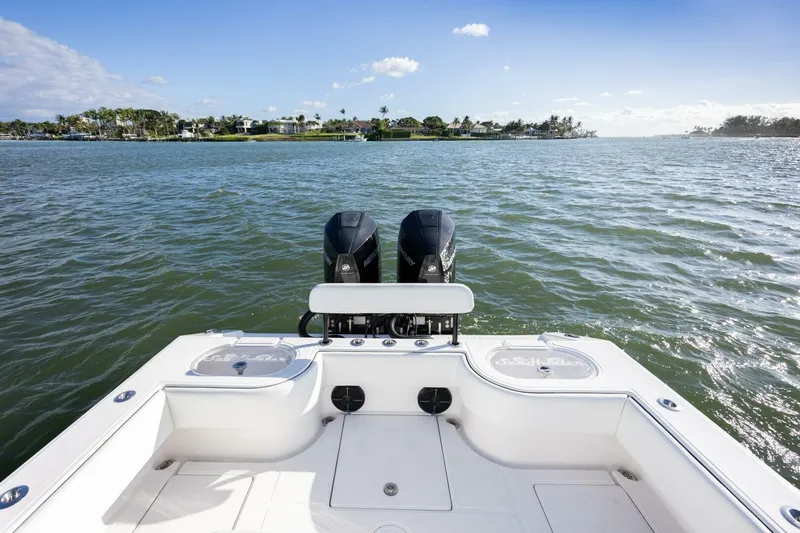  Yacht Photos Pics 2019 SeaHunter 28 Floridian boat on water, featuring dual engines and scenic coastal view.