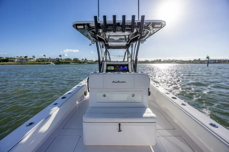  Yacht Photos Pics 2019 SeaHunter 28 Floridian boat on sunny water, showcasing sleek design and open deck.