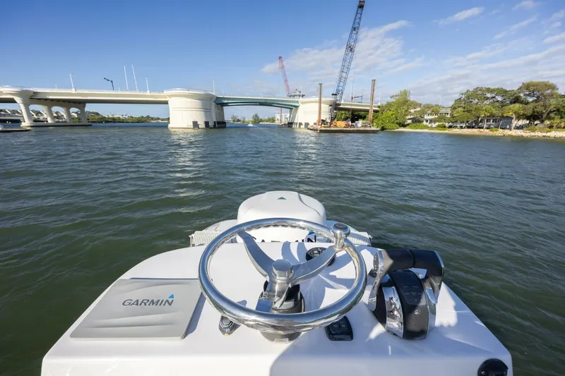  Yacht Photos Pics 2019 SeaHunter 28 Floridian boat steering view, approaching bridge on a sunny day.