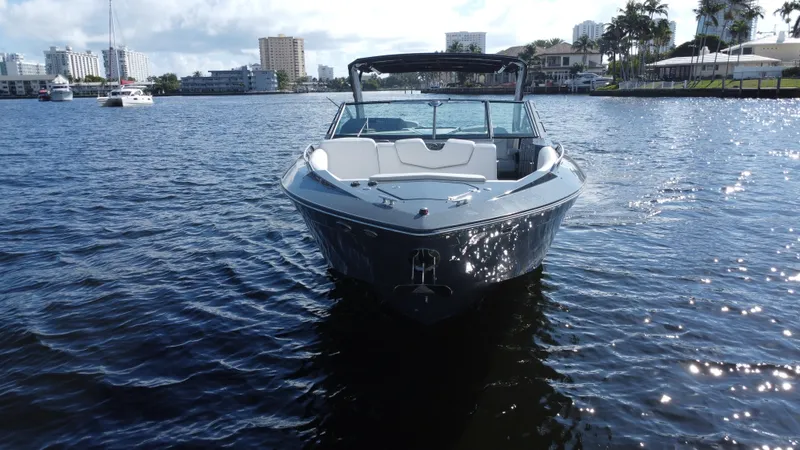 Tgis Yacht Photos Pics 2021 Cruisers Yachts 338 South Beach Edition Bow Rider on water, cityscape background.