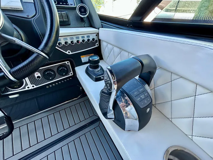 Tgis Yacht Photos Pics 2021 Cruisers Yachts 338 South Beach Edition Bow Rider cockpit with modern controls and luxurious design.