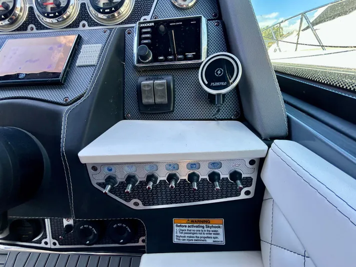 Tgis Yacht Photos Pics 2021 Cruisers Yachts 338 South Beach Edition Bow Rider dashboard with controls and gauges.