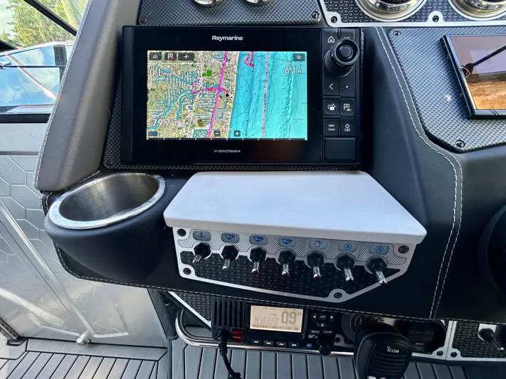 Tgis Yacht Photos Pics Control panel of 2021 Cruisers Yachts 338 South Beach Edition Bow Rider with navigation display.