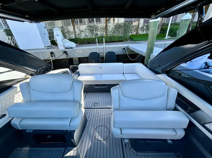 Tgis Yacht Photos Pics 2021 Cruisers Yachts 338 South Beach Edition Bow Rider with luxurious white seating and sleek design.