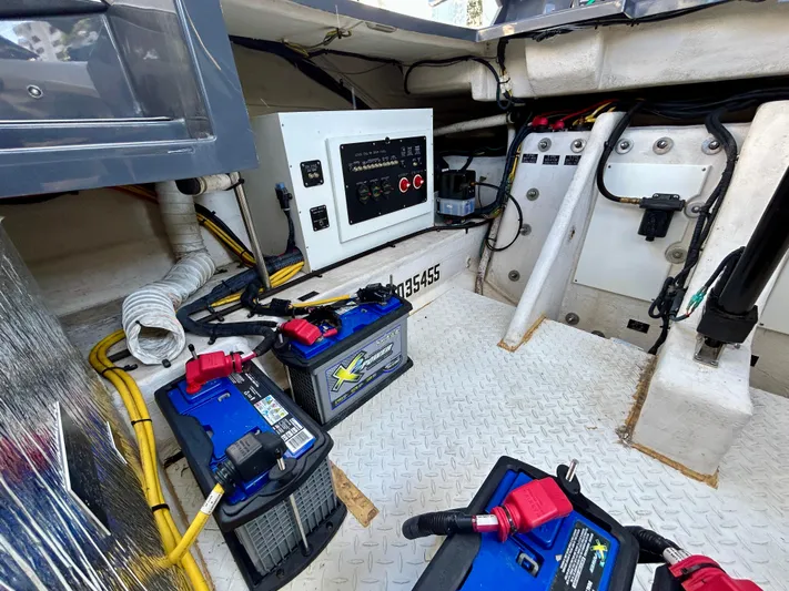 Tgis Yacht Photos Pics 2021 Cruisers Yachts 338 South Beach Edition engine compartment with batteries and control panel.