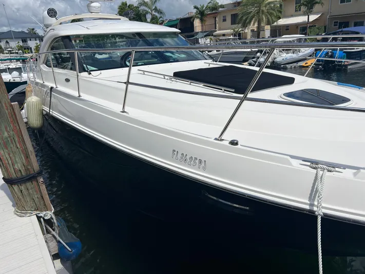  Yacht Photos Pics 2013 Sea Ray 410 Sundancer yacht docked at marina, sunny day.