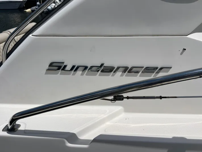  Yacht Photos Pics Sea Ray 410 Sundancer 2013 boat nameplate with chrome railing detail.