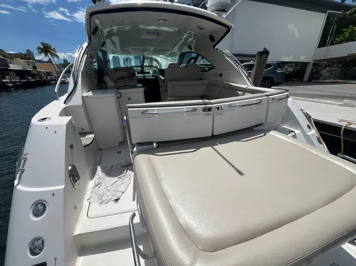  Yacht Photos Pics 2013 Sea Ray 410 Sundancer yacht with spacious seating and sleek design at a marina.