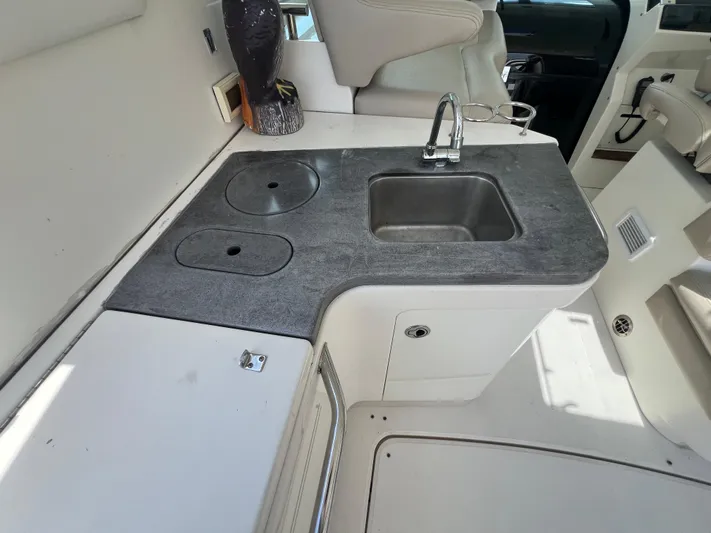  Yacht Photos Pics 2013 Sea Ray 410 Sundancer boat interior with sink and countertop.