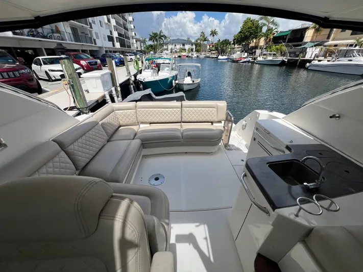  Yacht Photos Pics Luxurious 2013 Sea Ray 410 Sundancer yacht interior with plush seating and marina view.