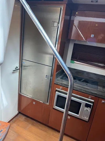 Yacht Photos Pics Interior of 2013 Sea Ray 410 Sundancer yacht kitchen with stainless appliances.