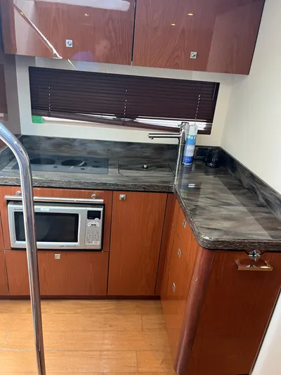  Yacht Photos Pics Luxurious kitchen area in 2013 Sea Ray 410 Sundancer yacht with modern appliances.