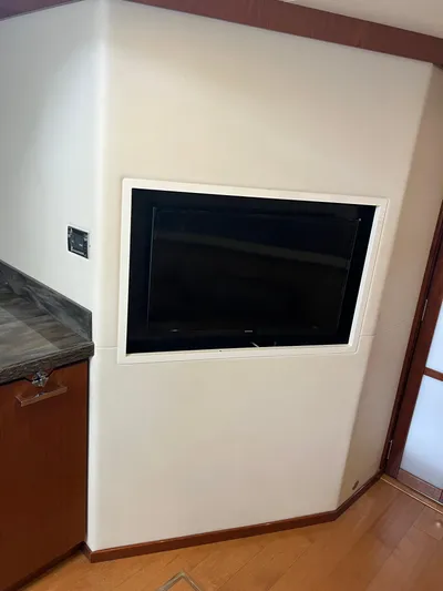  Yacht Photos Pics Built-in TV on Sea Ray 410 Sundancer yacht, 2013 model, with wooden cabinetry.