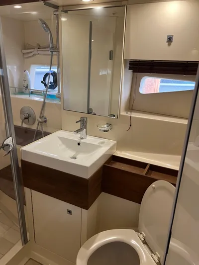  Yacht Photos Pics Luxurious bathroom in 2013 Sea Ray 410 Sundancer yacht with modern fixtures and shower.