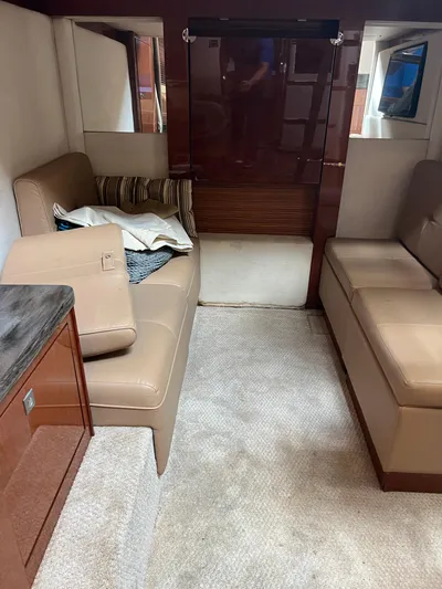  Yacht Photos Pics Interior of 2013 Sea Ray 410 Sundancer with beige seating and carpet.