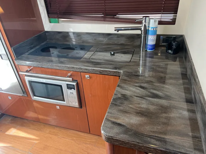  Yacht Photos Pics Modern kitchen area in a 2013 Sea Ray 410 Sundancer yacht.