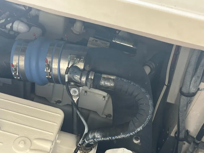  Yacht Photos Pics Engine compartment of 2013 Sea Ray 410 Sundancer with visible hoses and clamps.