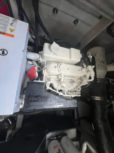  Yacht Photos Pics Engine compartment of a 2013 Sea Ray 410 Sundancer boat, showcasing mechanical components.
